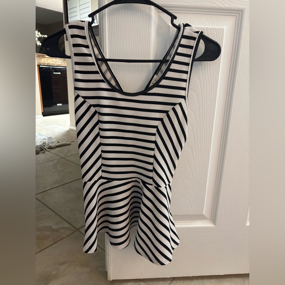 Love J black and white peplum top with bow detail